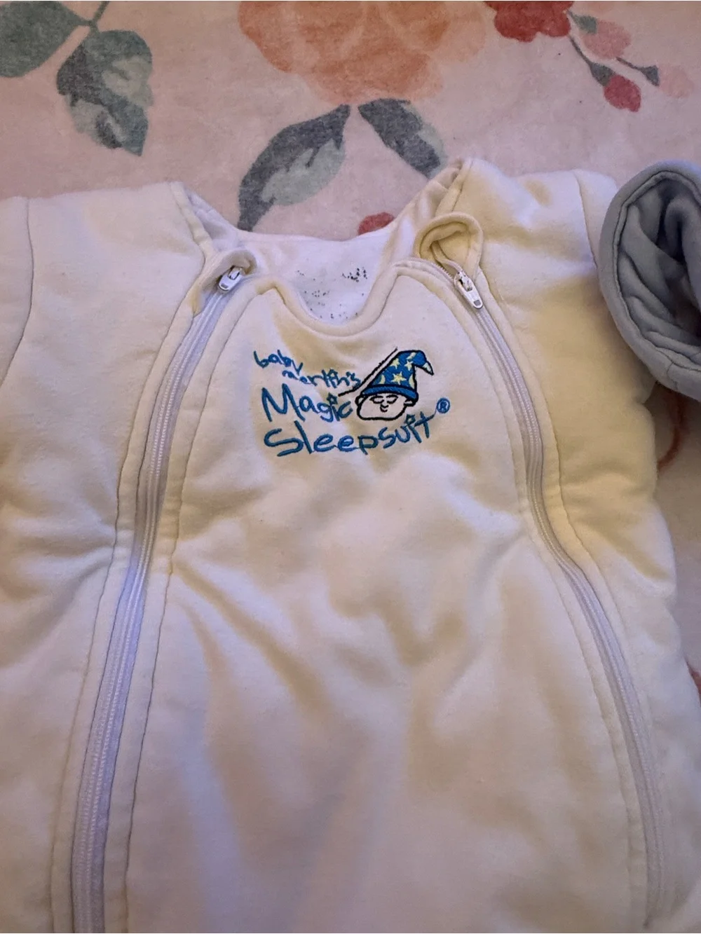 Two baby Merlin magic sleep suits- Cream and Light Blue
